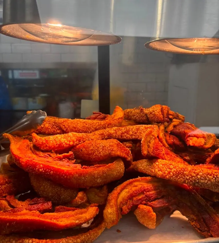 Fresh chicharron at the hot kitchen counter
